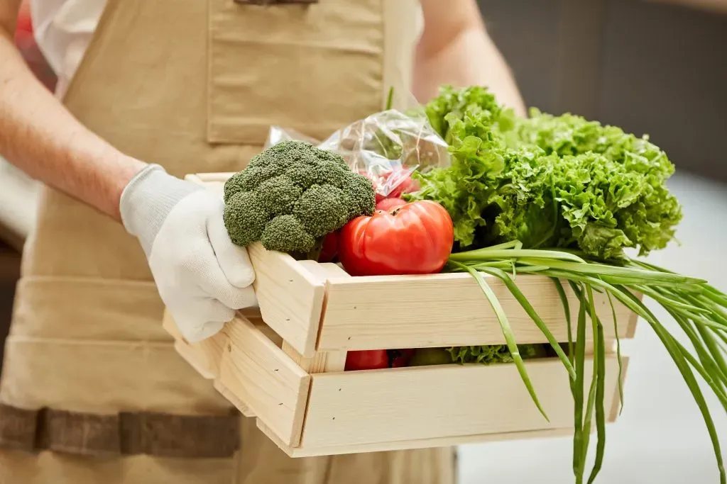closeup of farmer holding box of vegetables 2025 03 09 02 52 18 utc Aluminium Gutter Components - Chandling Products